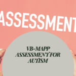 Hands holding an “ASSESSMENT” sign with “VB-MAPP Assessment for Autism” displayed in the center.