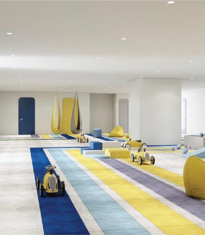 Hanging pod swings and ride-on toys in the movement area at Blue Gems ABA center in Woodlawn, Maryland.